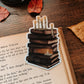 Melting Candles and Books Glow Sticker